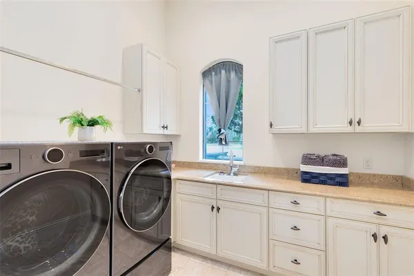 a view of a hallway with wooden floor and windows