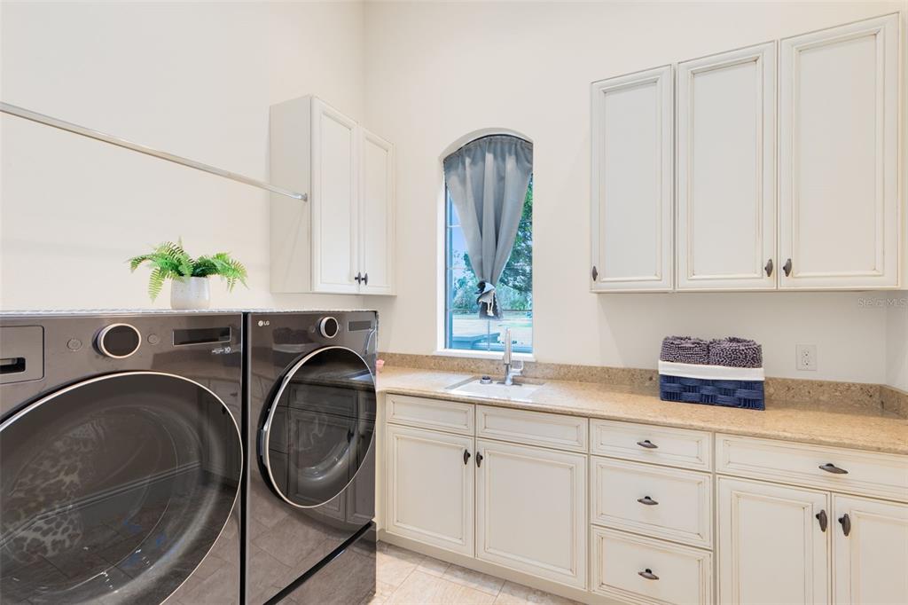 5300 Carson Street St. Cloud, FL 34771 - Photo 27 of 59 a utility room with sink dryer and washer