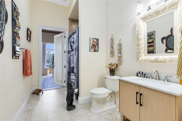 a living room with furniture large window and a flat screen tv
