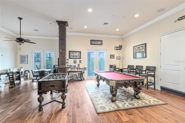 a view of a patio with swimming pool table and chairs