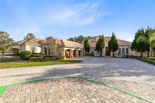 an aerial view of house with yard swimming pool and outdoor seating