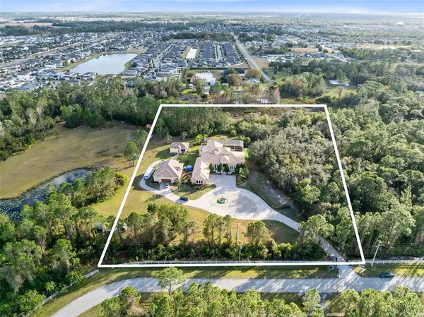 a view of a swimming pool with a yard