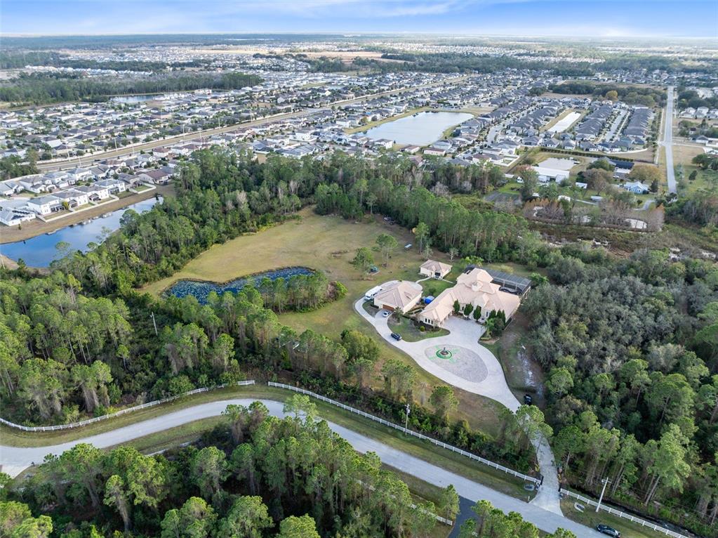 5300 Carson Street St. Cloud, FL 34771 - Photo 58 of 59 an aerial view of a house with a yard