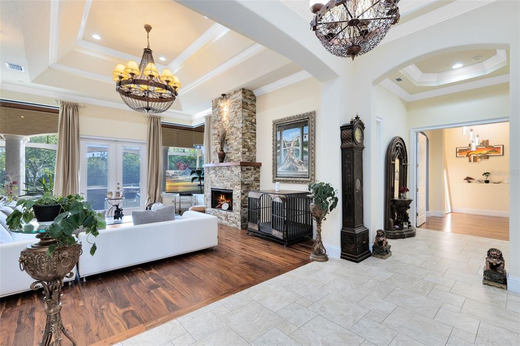5300 Carson Street St. Cloud, FL 34771 - Photo 7 of 59 a living room with fireplace furniture and a chandelier