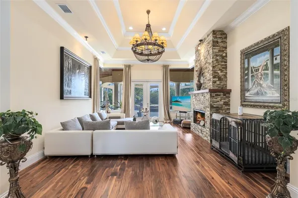 a view of a livingroom with furniture and a chandelier