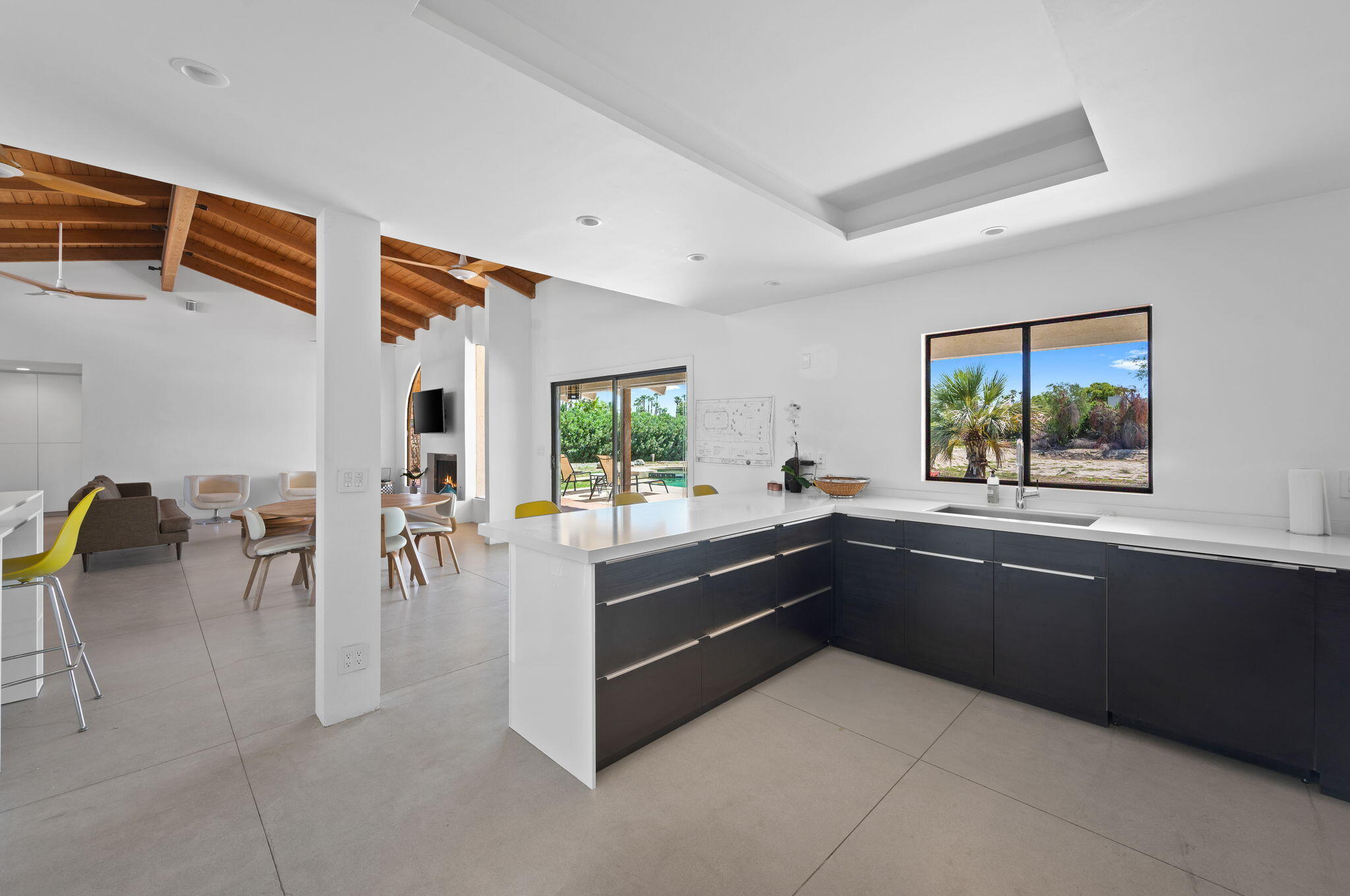 77725 Robin Road Palm Desert, CA 92211 - Photo 18 of 43 a kitchen with sink and view of living room