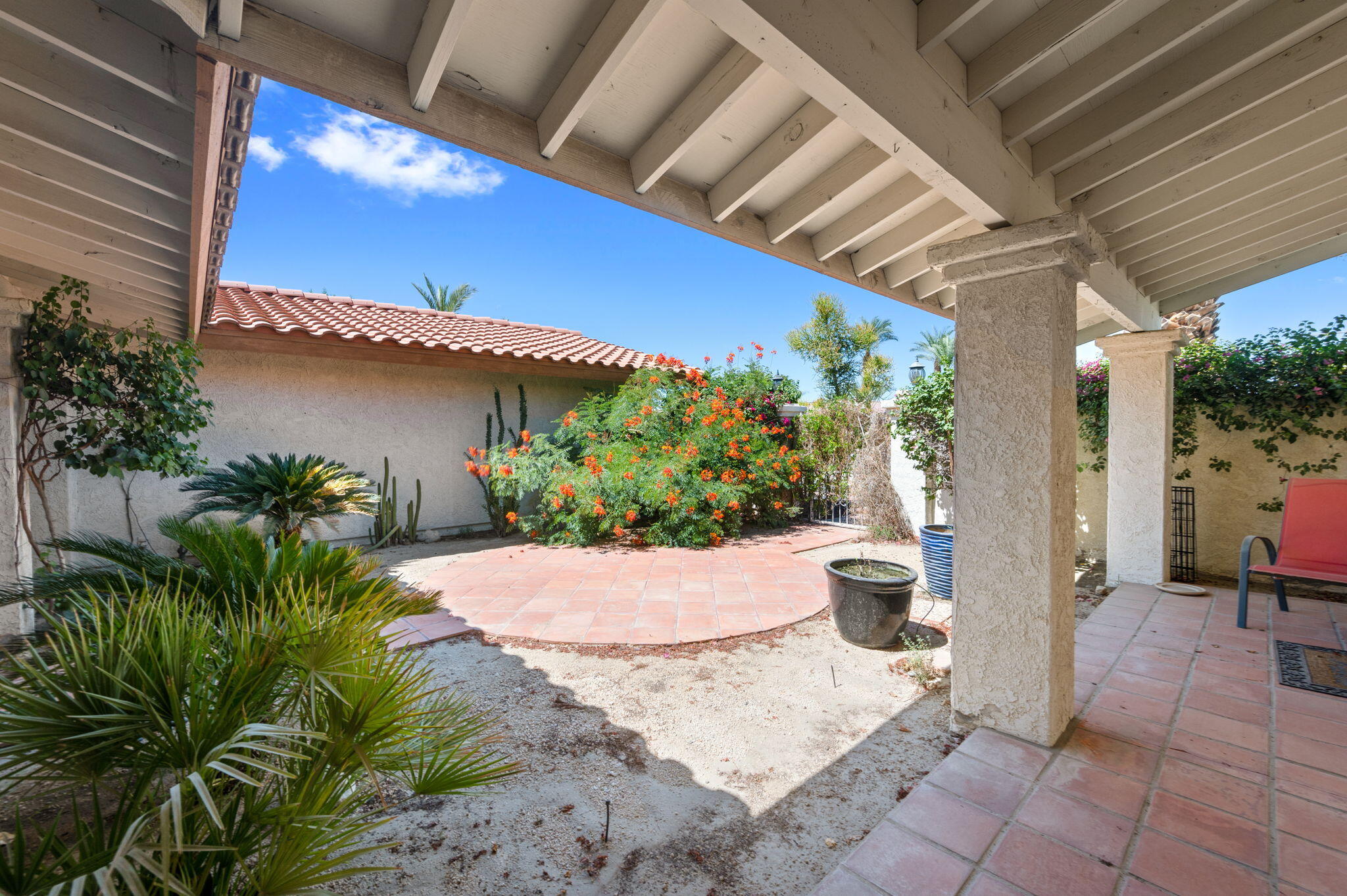 77725 Robin Road Palm Desert, CA 92211 - Photo 8 of 43 a view of a backyard with plants and a patio