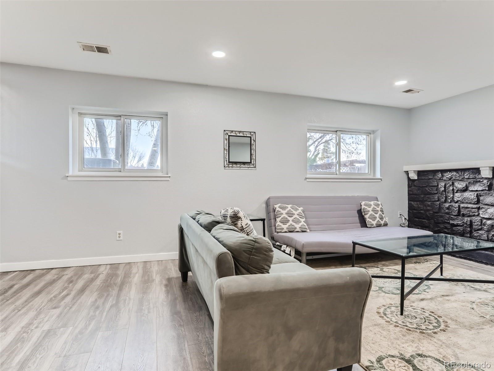 5941 South Perth Street Centennial, CO 80015 - Photo 13 of 28 a living room with furniture and a window
