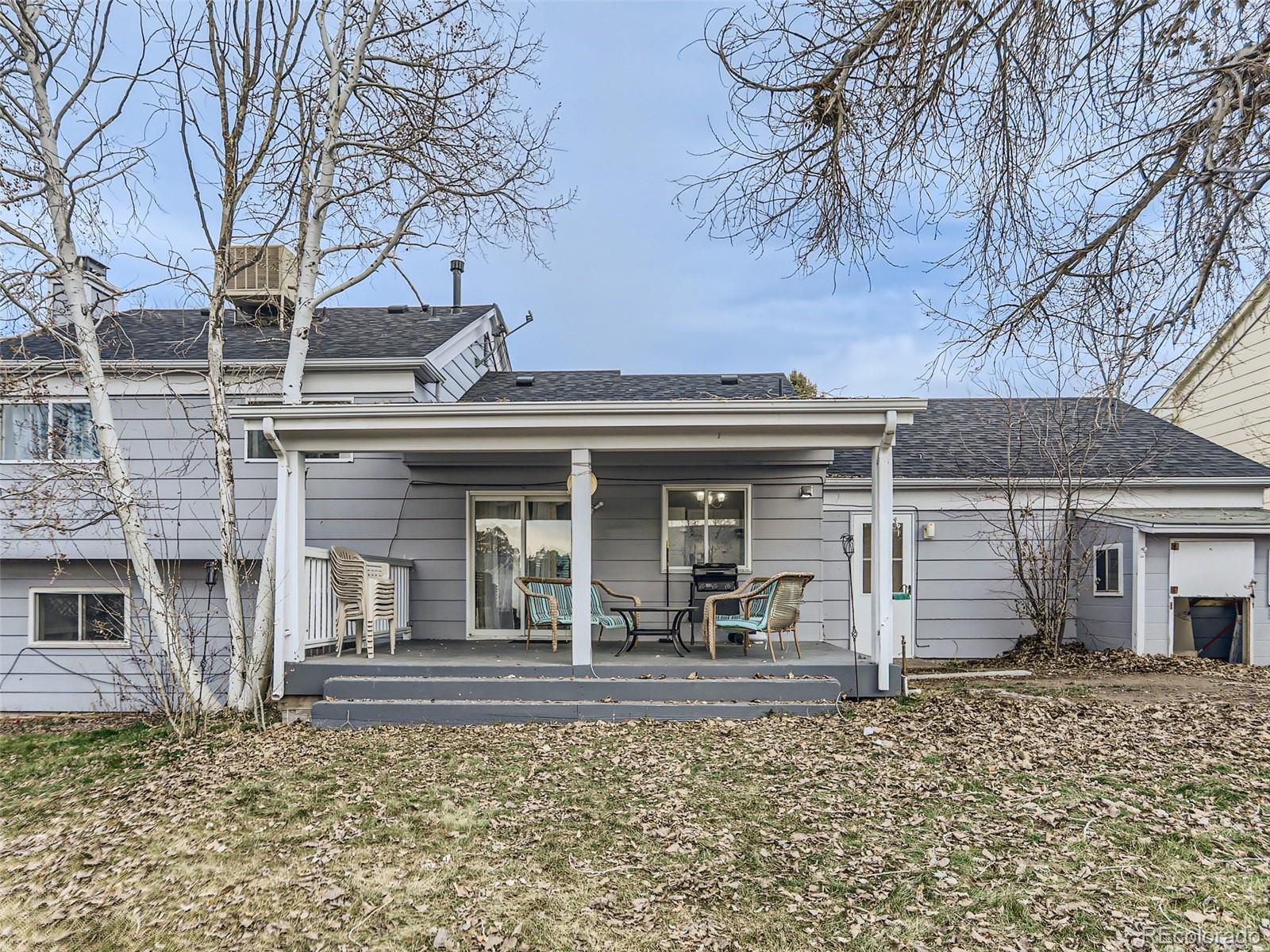 5941 South Perth Street Centennial, CO 80015 - Photo 28 of 28 front view of a house with a yard