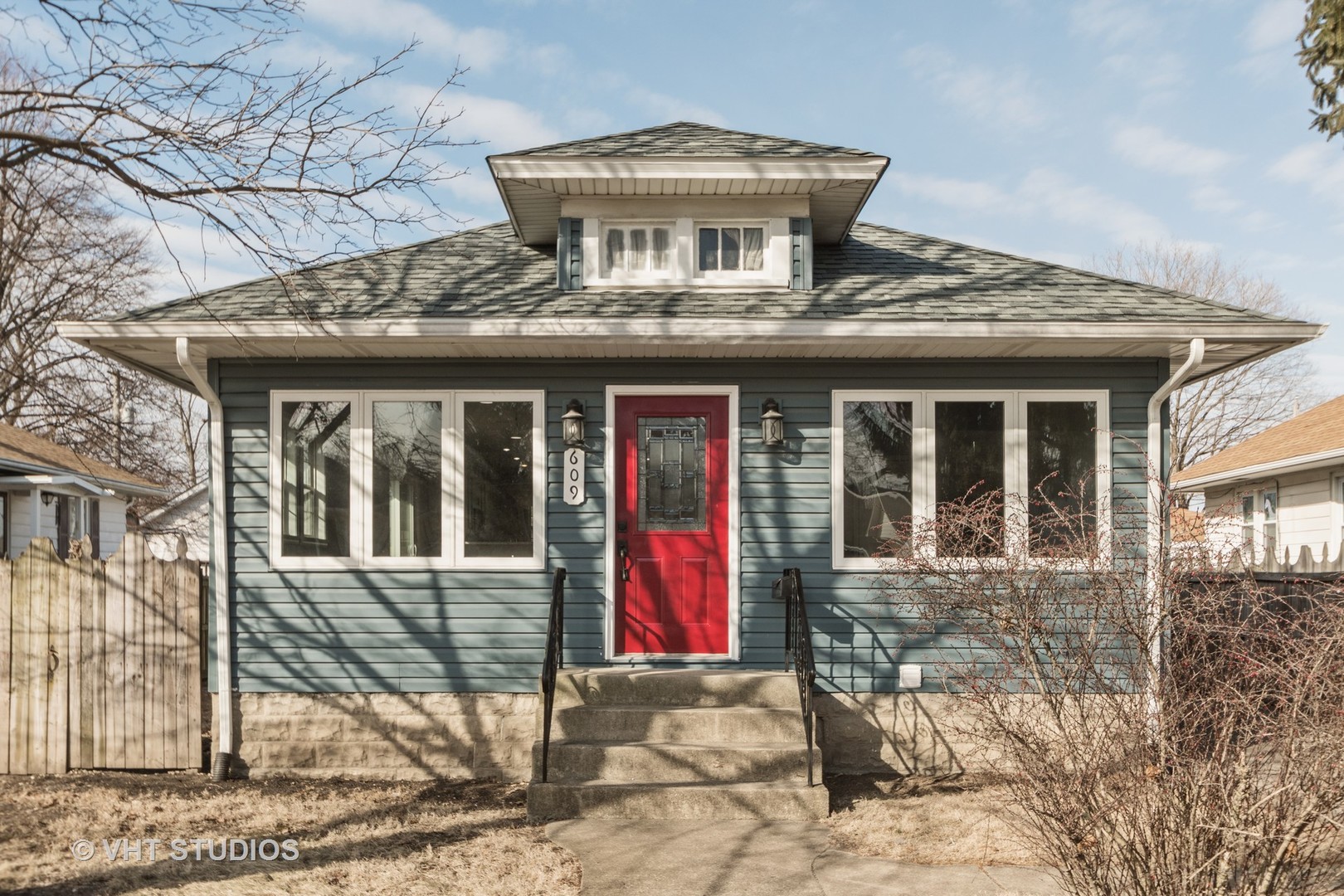 609 North Reed Street Joliet, IL 60435 - Photo 1 of 19 a front view of a house with a yard