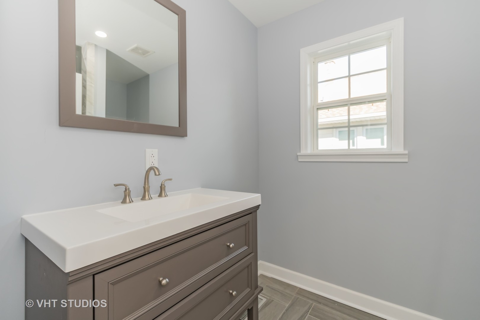 609 North Reed Street Joliet, IL 60435 - Photo 14 of 19 a bathroom with a sink vanity and a mirror