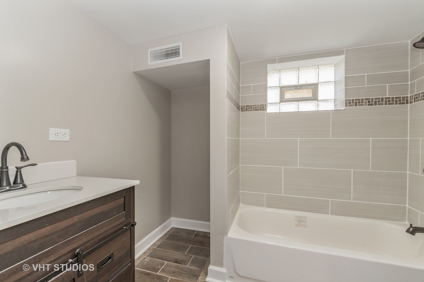 609 North Reed Street Joliet, IL 60435 - Photo 16 of 19 a white bath tub sitting next to a white sink