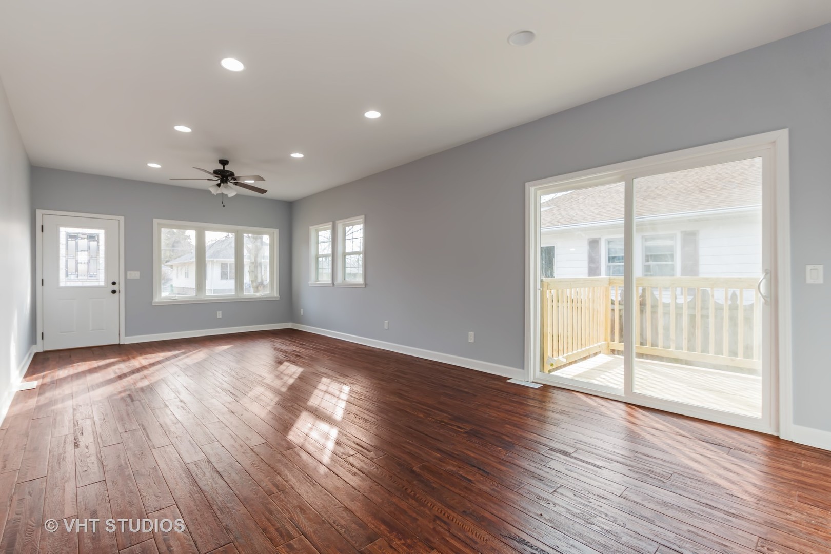 609 North Reed Street Joliet, IL 60435 - Photo 4 of 19 a view of an empty room with wooden floor and a window