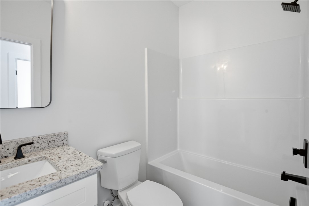 115 Riley Street Westminster, SC 29693 - Photo 9 of 46 This bathroom features a contemporary design with a practical vanity and integrated shower-tub combination.