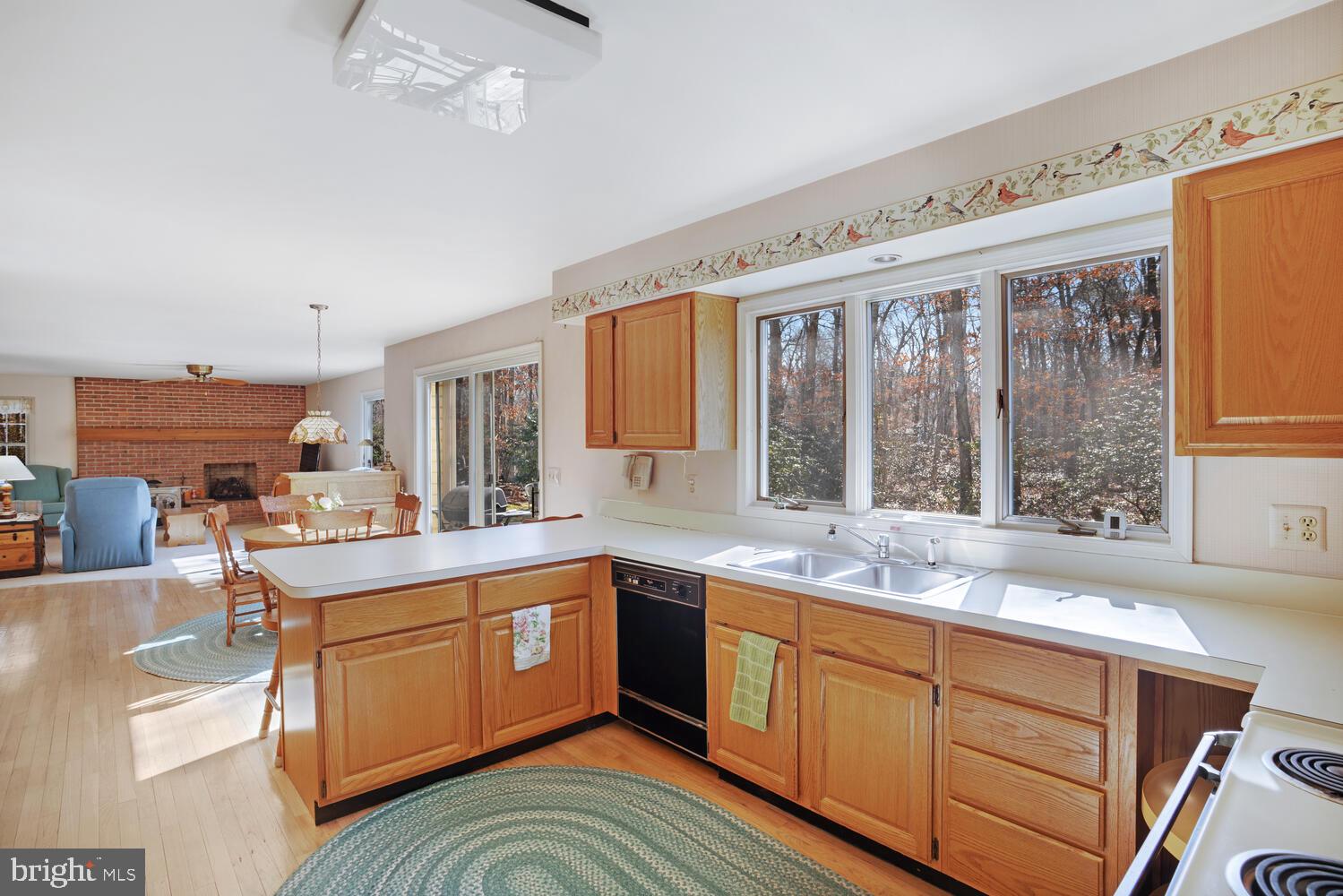 39 John Street Little Egg Harbor, NJ 08087 - Photo 15 of 40 a kitchen with a sink window and cabinets