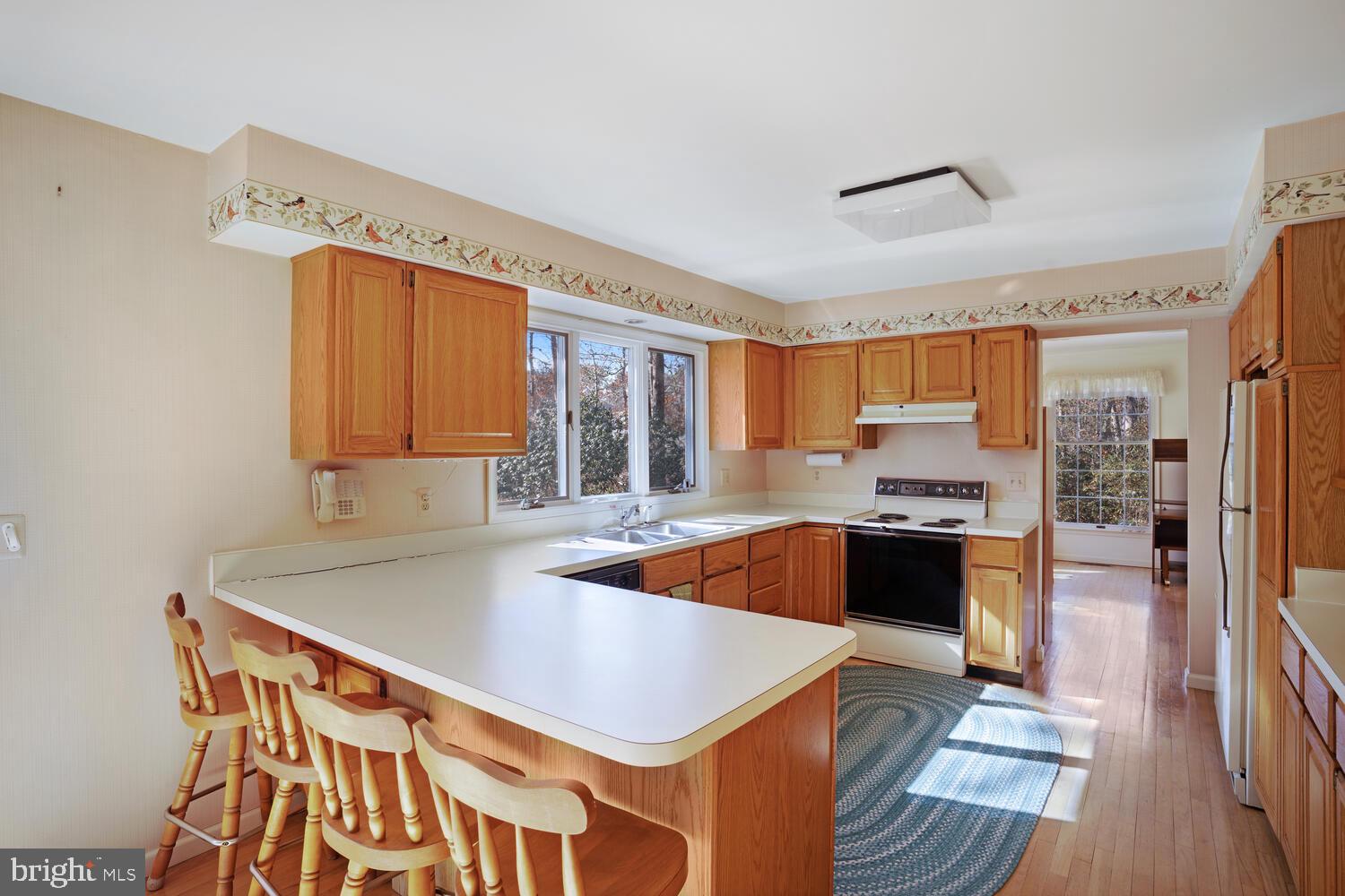 39 John Street Little Egg Harbor, NJ 08087 - Photo 16 of 40 a kitchen with stainless steel appliances granite countertop a sink and a refrigerator