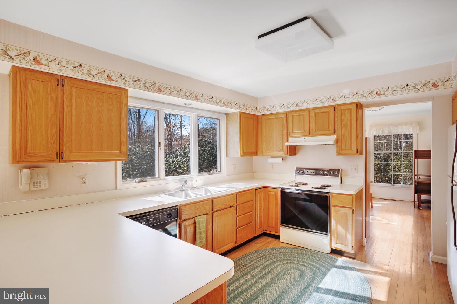 39 John Street Little Egg Harbor, NJ 08087 - Photo 18 of 40 a kitchen with stainless steel appliances granite countertop a sink stove and refrigerator