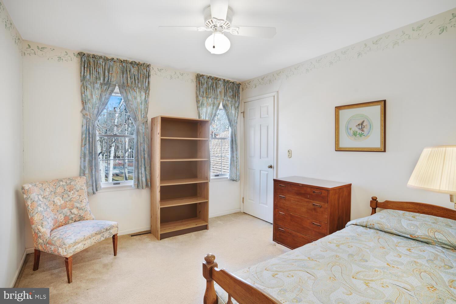 39 John Street Little Egg Harbor, NJ 08087 - Photo 27 of 40 a bedroom with a bed and a chair