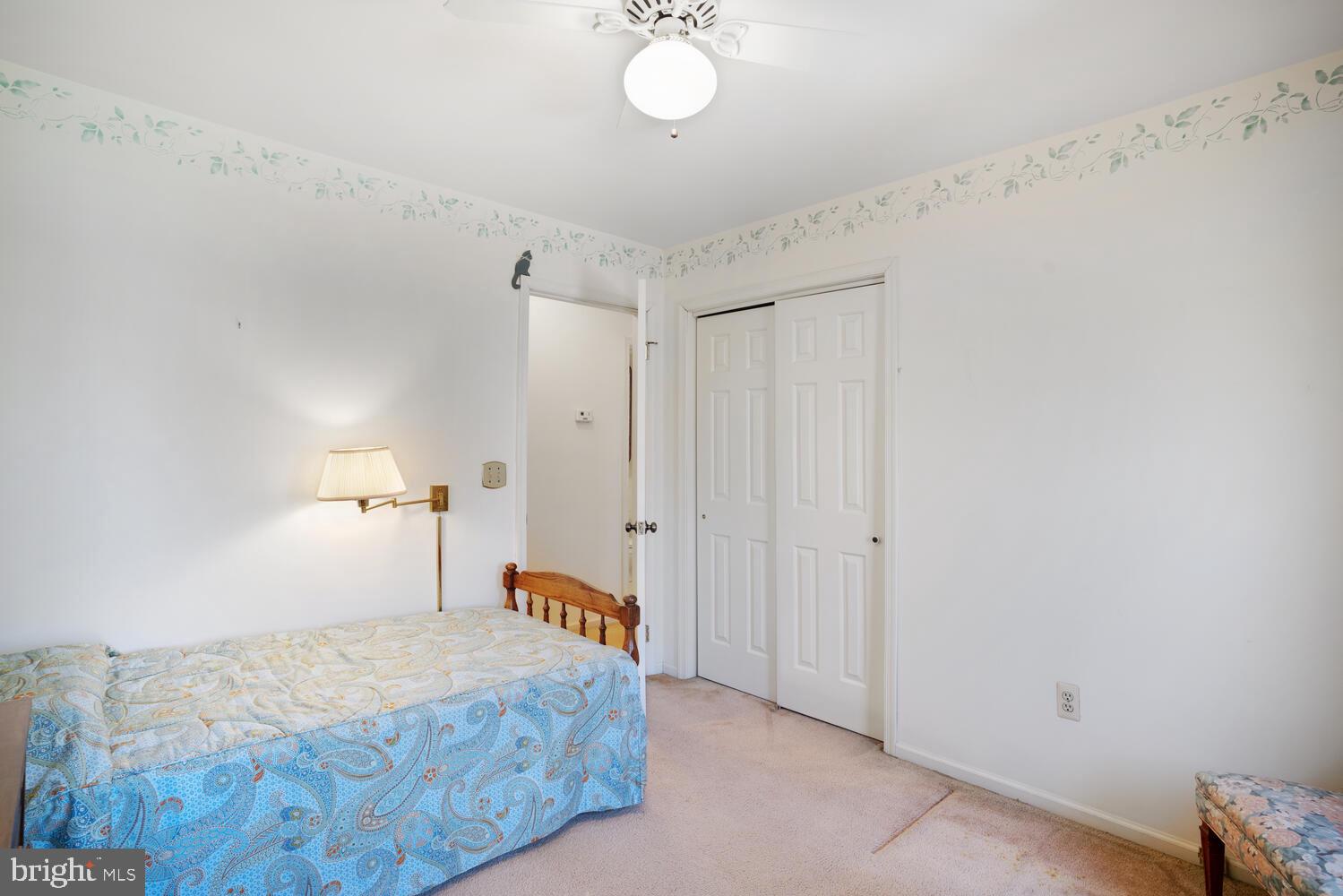 39 John Street Little Egg Harbor, NJ 08087 - Photo 28 of 40 a bedroom with a bed and a chandelier
