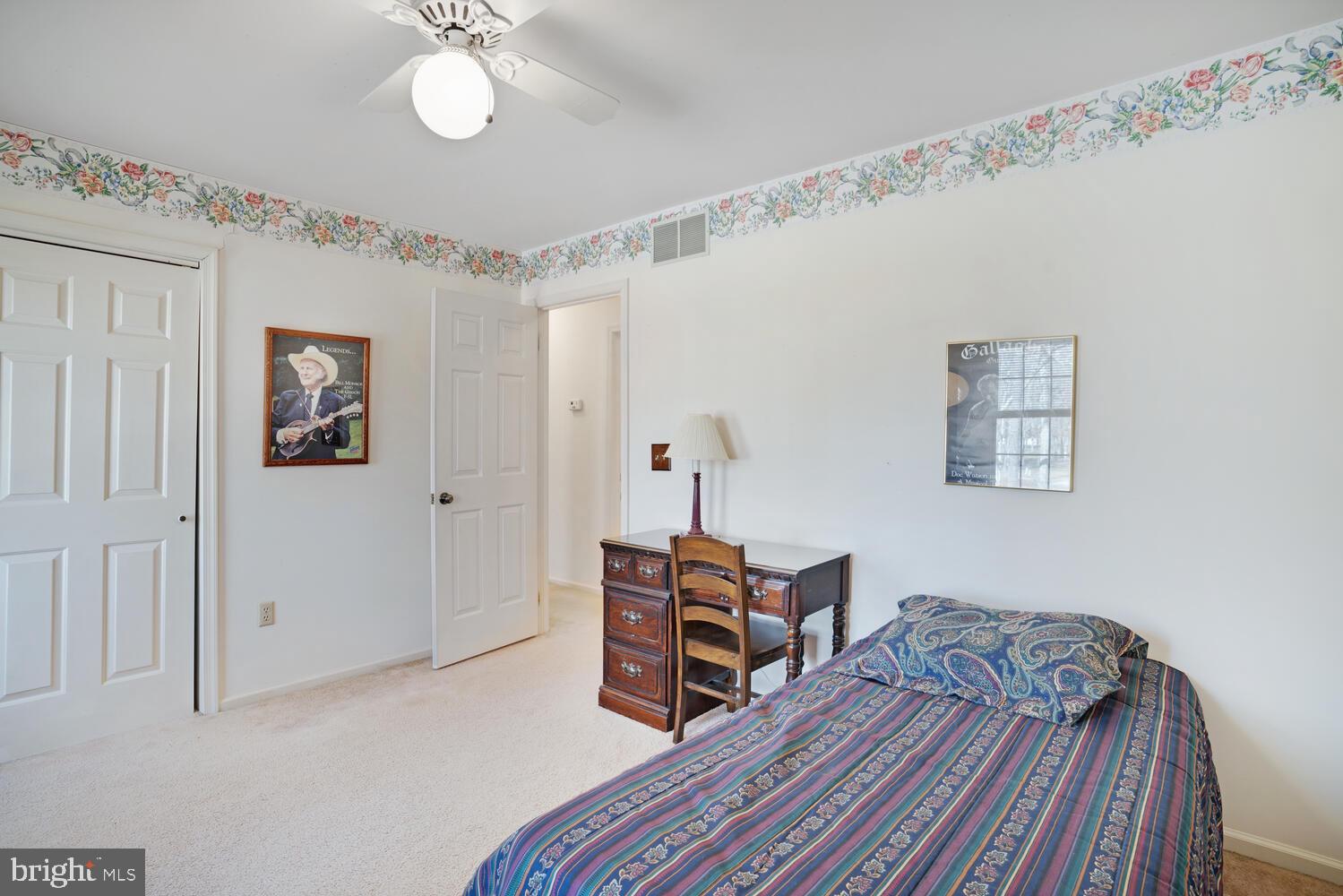 39 John Street Little Egg Harbor, NJ 08087 - Photo 31 of 40 a bedroom with a bed and a chandelier