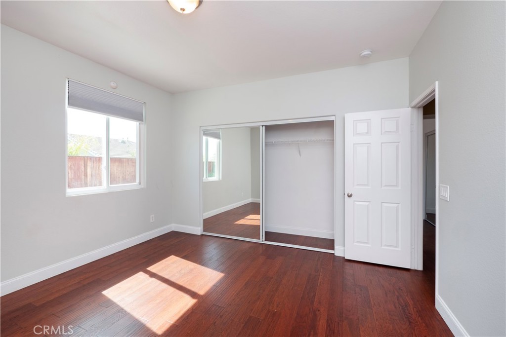 19128 Trail Ride Court Perris, CA 92570 - Photo 28 of 50 a very nice looking room with a window and wooden floor