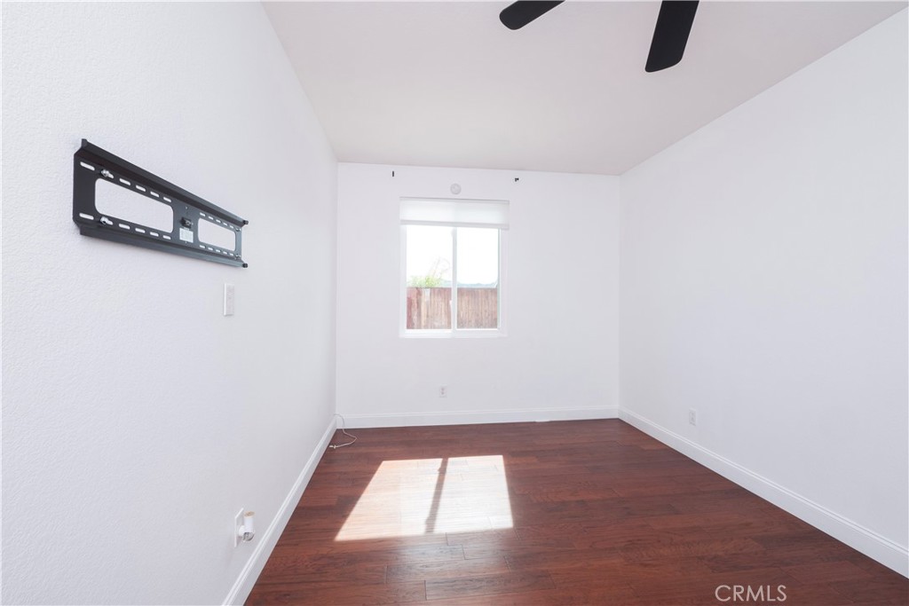 19128 Trail Ride Court Perris, CA 92570 - Photo 29 of 50 an empty room with a window