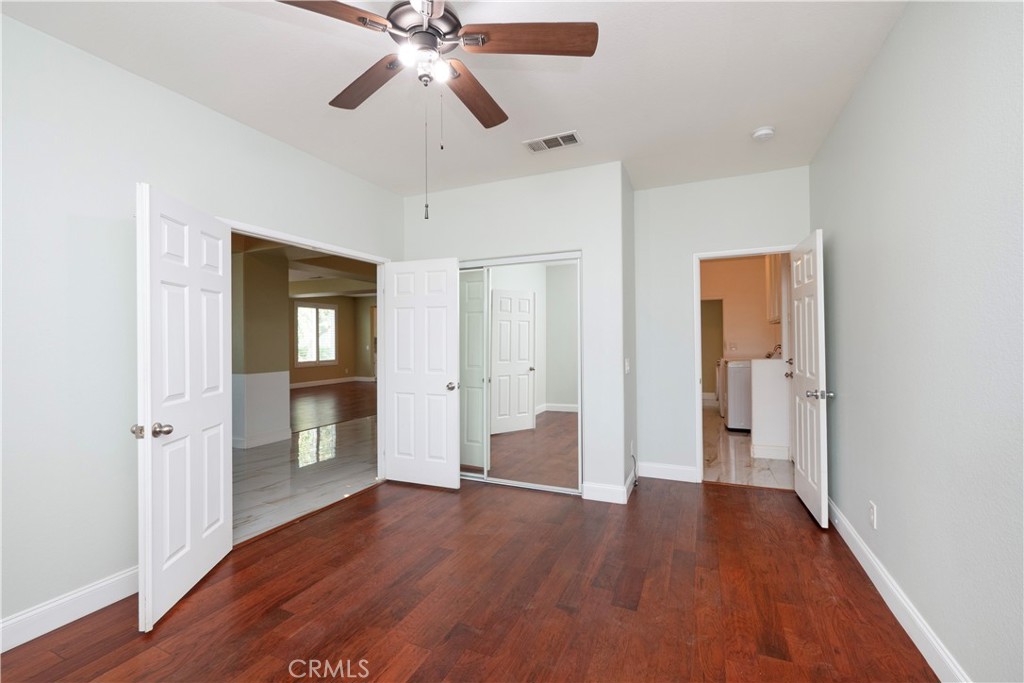 19128 Trail Ride Court Perris, CA 92570 - Photo 32 of 50 a view of empty room with wooden floor