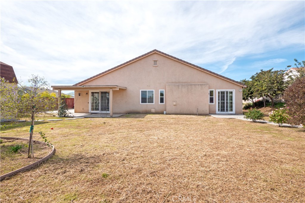 19128 Trail Ride Court Perris, CA 92570 - Photo 35 of 50 a view of a house with a yard