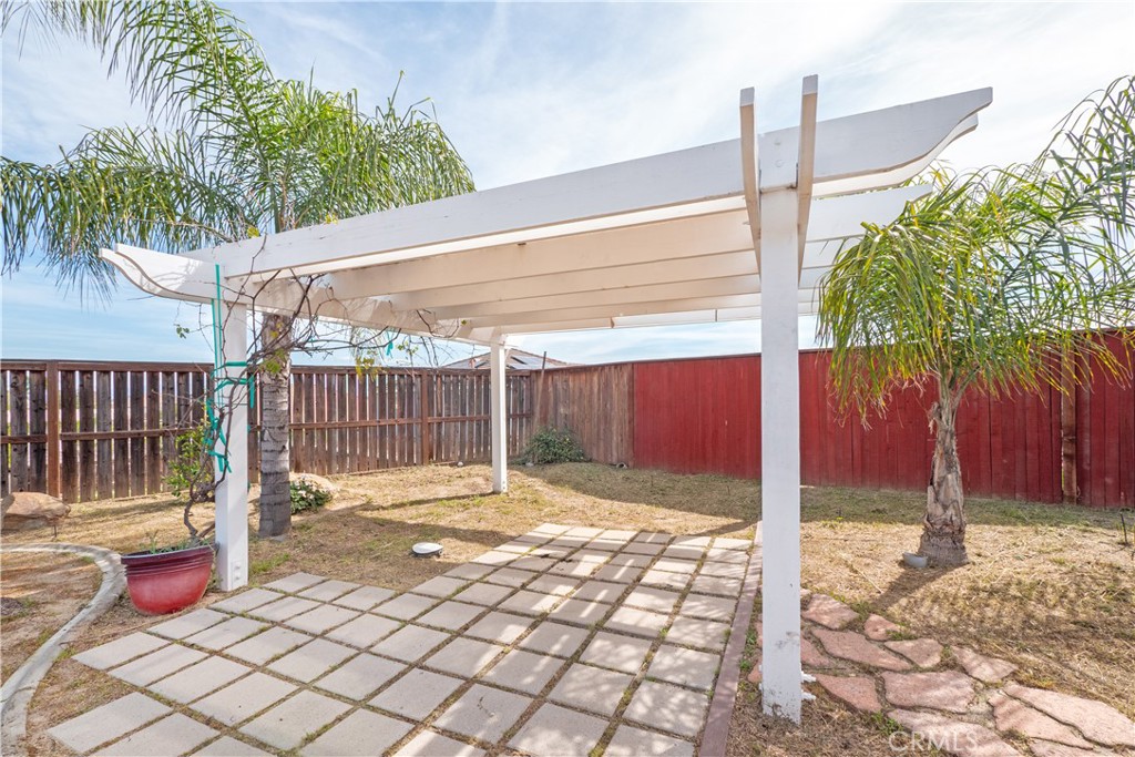19128 Trail Ride Court Perris, CA 92570 - Photo 37 of 50 a backyard of a house with lots of green space