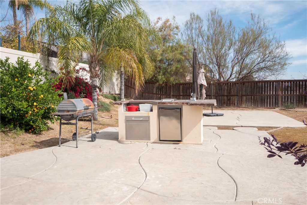19128 Trail Ride Court Perris, CA 92570 - Photo 39 of 50 a view of a patio with a yard