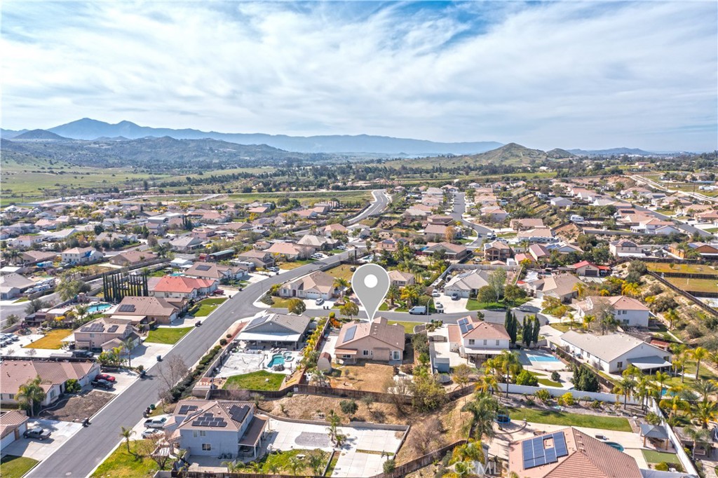 19128 Trail Ride Court Perris, CA 92570 - Photo 50 of 50 an aerial view of residential building with green space