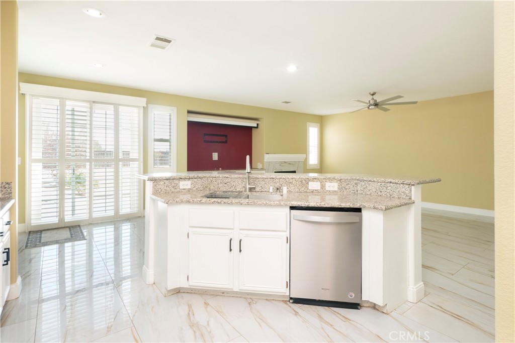 19128 Trail Ride Court Perris, CA 92570 - Photo 6 of 50 a bathroom with a granite countertop sink and a mirror