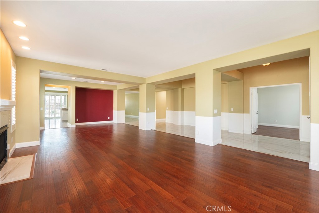 19128 Trail Ride Court Perris, CA 92570 - Photo 10 of 50 a view of an empty room with wooden floor and a window