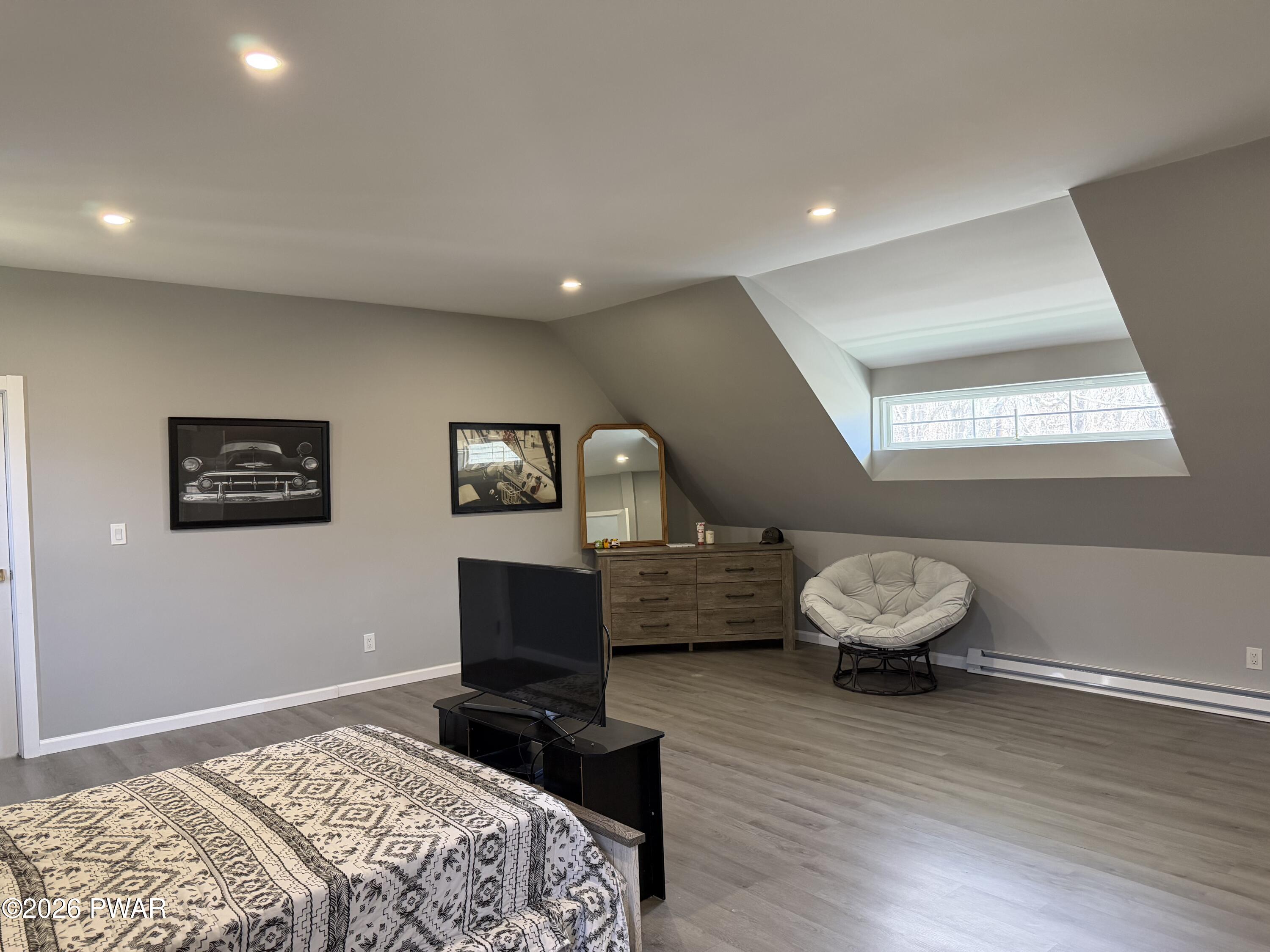 801 Maple Ridge Court Hawley, PA 18428 - Photo 48 of 55 a bedroom with a bed and a window