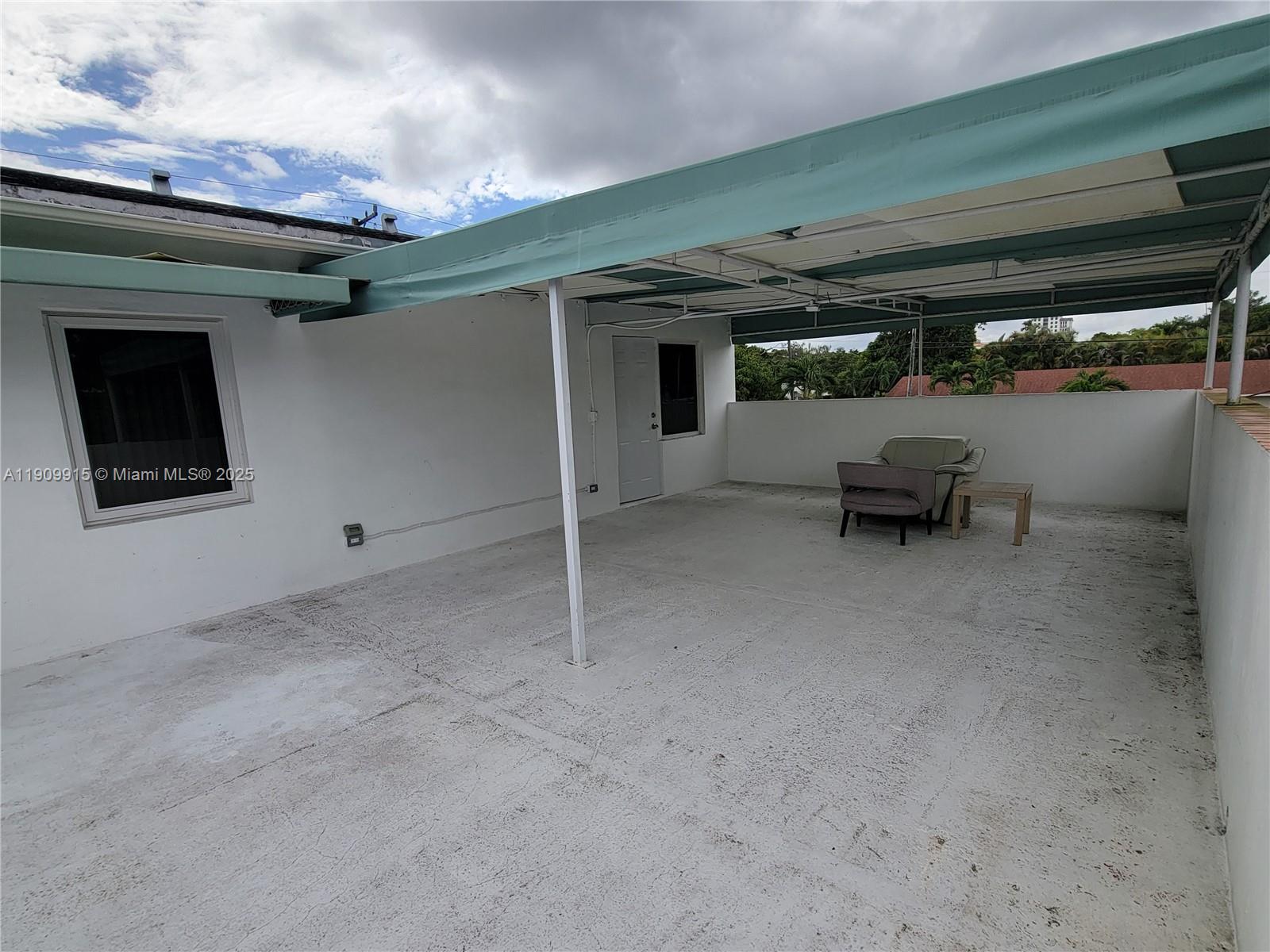 3433 Southwest 12th Street, Unit UPSTAIRS Miami, FL 33135 - Photo 21 of 23 Huge covered 2nd floor patio view west