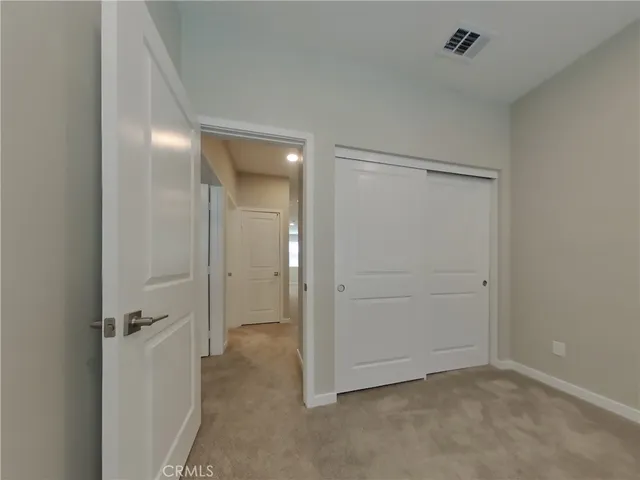 an empty room with a bathroom