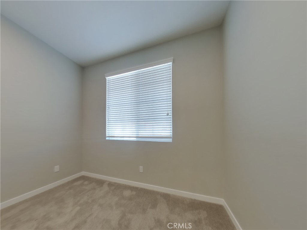 36567 Pepino Court Wildomar, CA 92595 - Photo 13 of 31 an empty room with a window