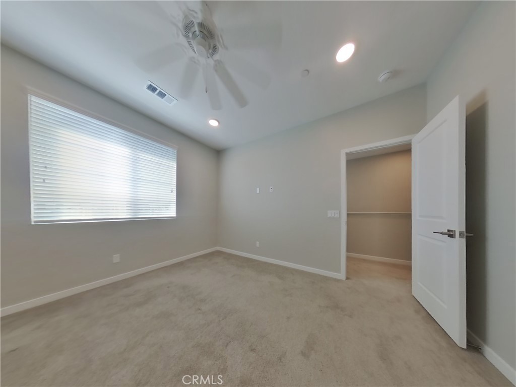 36567 Pepino Court Wildomar, CA 92595 - Photo 6 of 31 an empty room with windows and closet