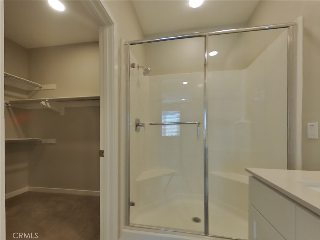 36567 Pepino Court Wildomar, CA 92595 - Photo 9 of 31 a bathroom with a glass shower door