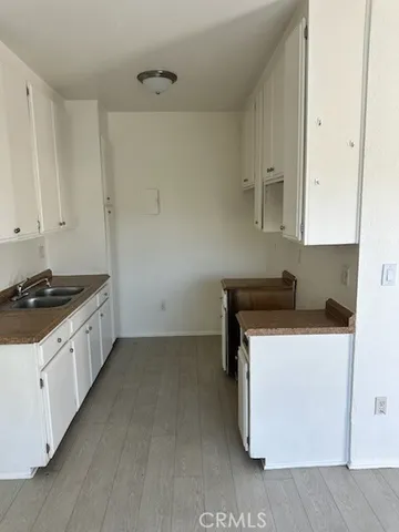 a kitchen with a stove and a sink