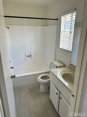 a bathroom with a sink a toilet and a bathtub