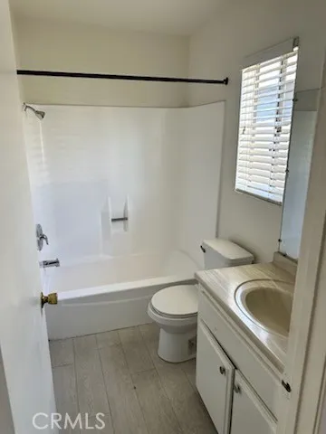 a bathroom with a sink a toilet and a bathtub