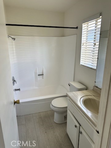 11906 Hart Street, Unit 6 North Hollywood, CA 91605 - Photo 7 of 10 a bathroom with a sink a toilet and a bathtub