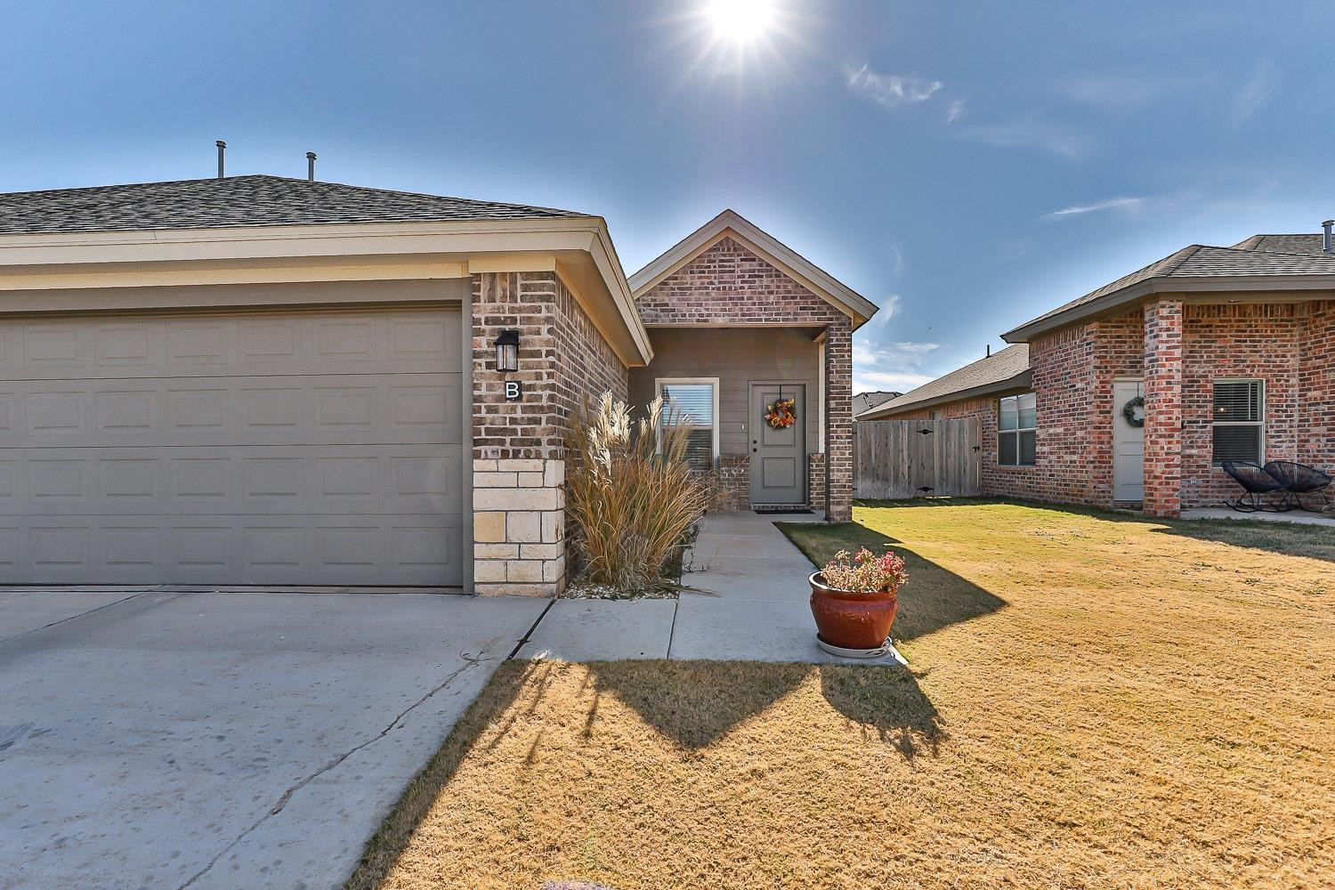 5517 121st Street, Unit B Lubbock, TX 79424 - Photo 4 of 37 a view of a house with swimming pool