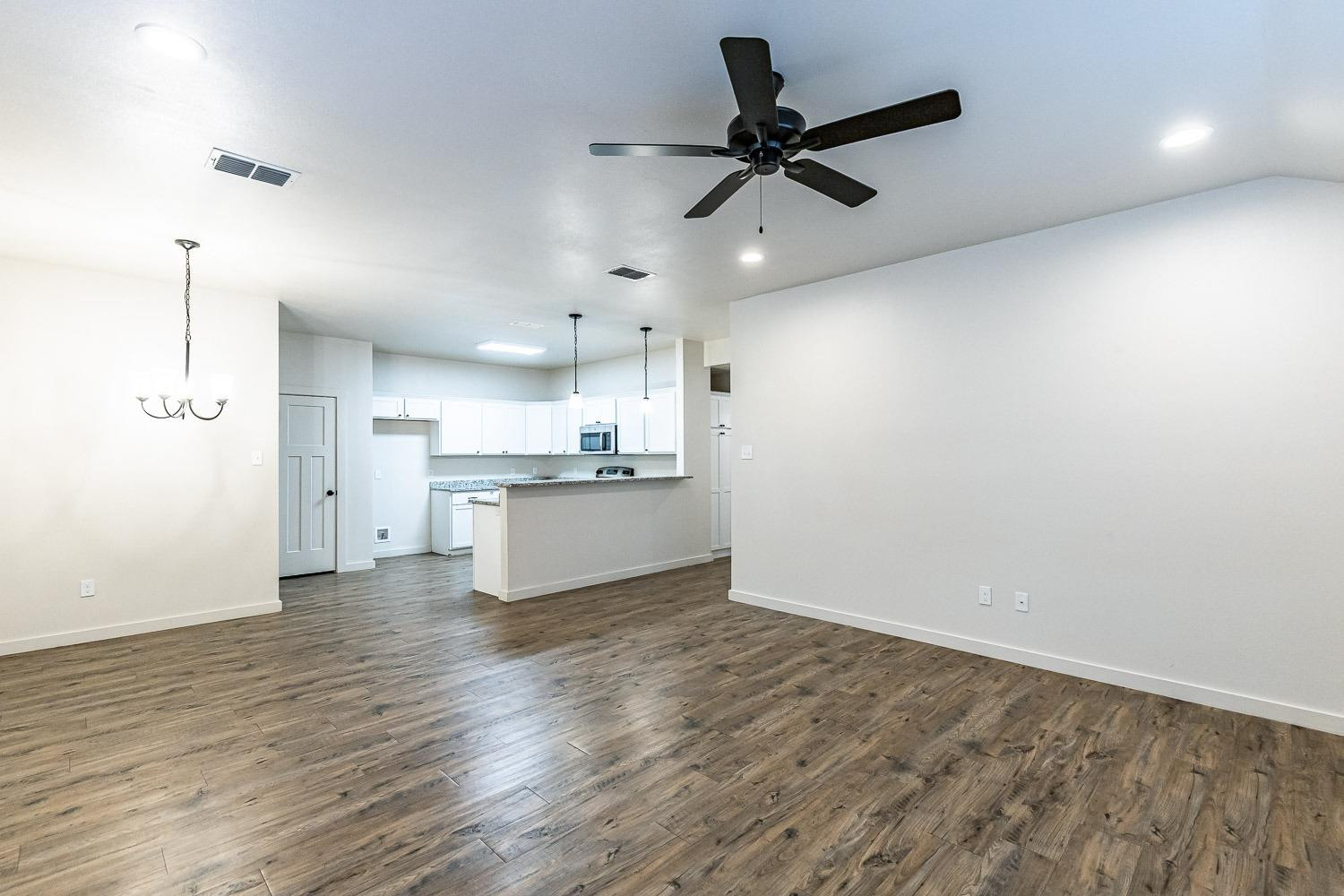 5517 121st Street, Unit B Lubbock, TX 79424 - Photo 7 of 37 a view of a kitchen with a sink and refrigerator