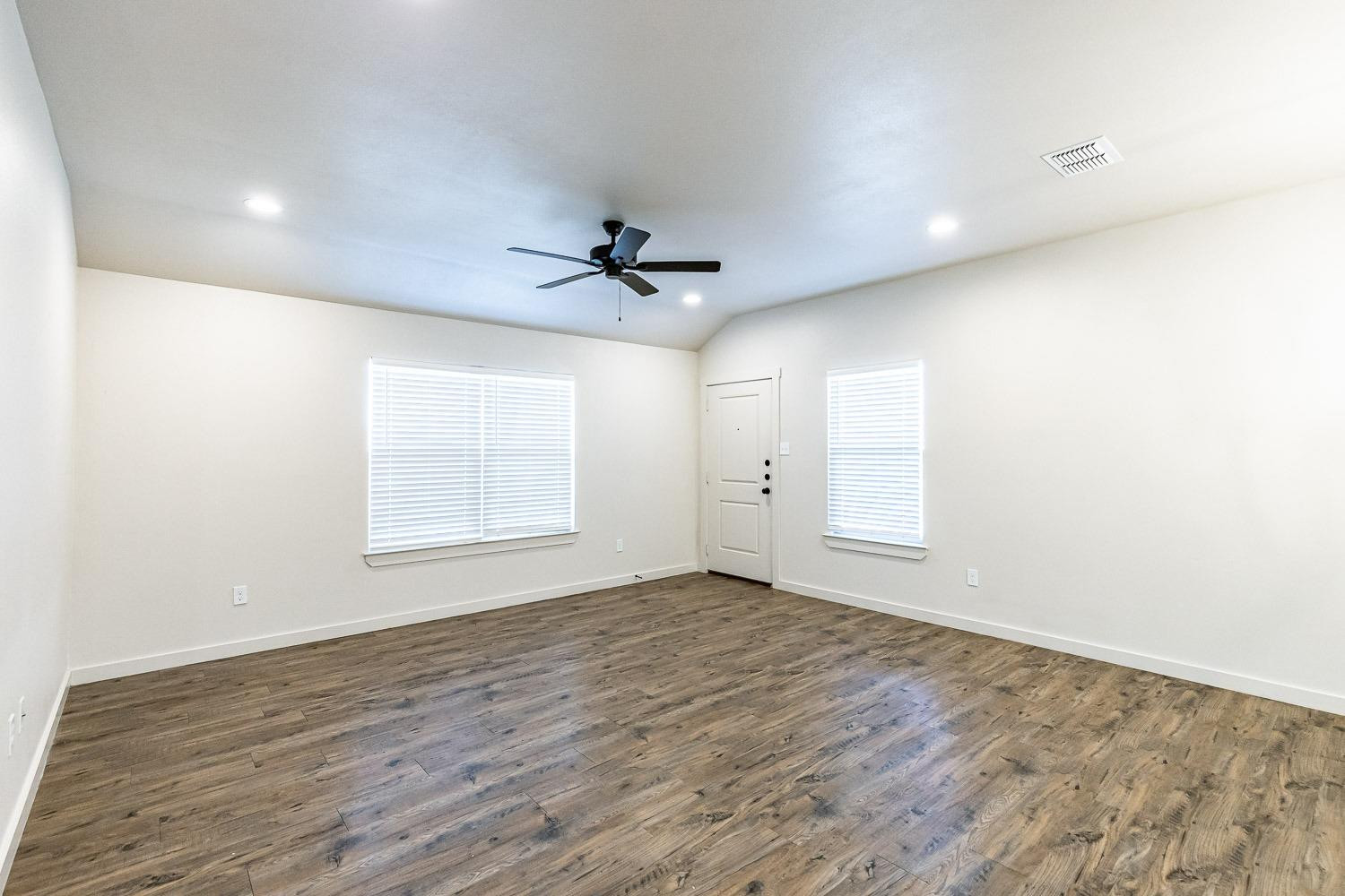 5517 121st Street, Unit B Lubbock, TX 79424 - Photo 10 of 37 a view of an empty room with a window