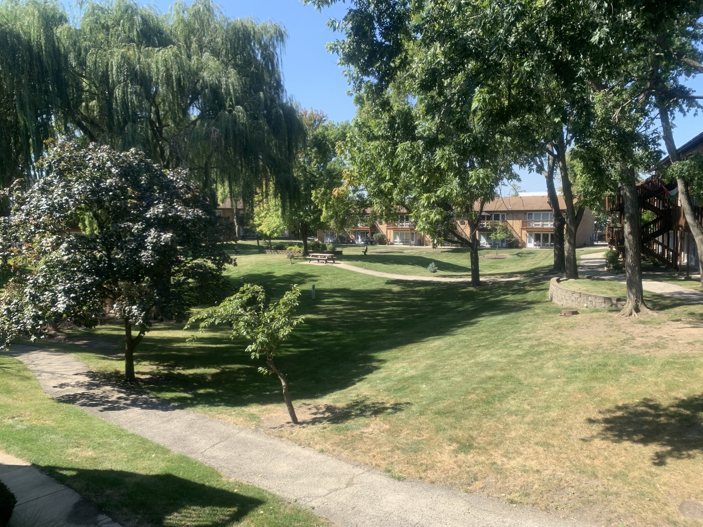 4424 Arbor Circle, Unit 3 Downers Grove, IL 60515 - Photo 12 of 12 a backyard of a house with a yard and outdoor seating