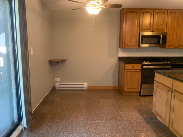 a view of cabinets and wooden floor