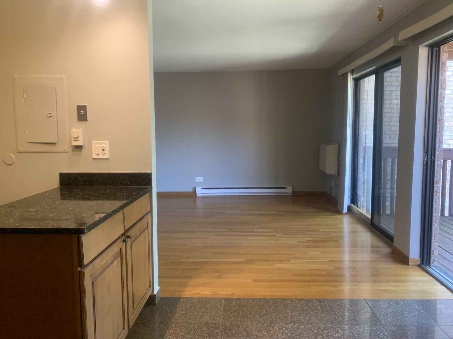 4424 Arbor Circle, Unit 3 Downers Grove, IL 60515 - Photo 5 of 12 a kitchen with kitchen island a sink a counter top space and cabinets