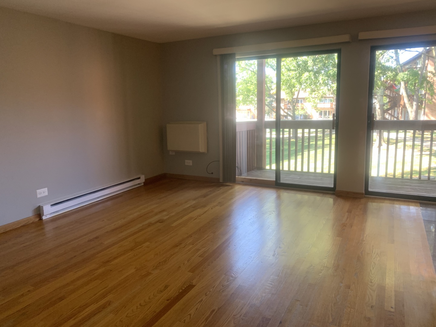 4424 Arbor Circle, Unit 3 Downers Grove, IL 60515 - Photo 6 of 12 wooden floor in an empty room with a window